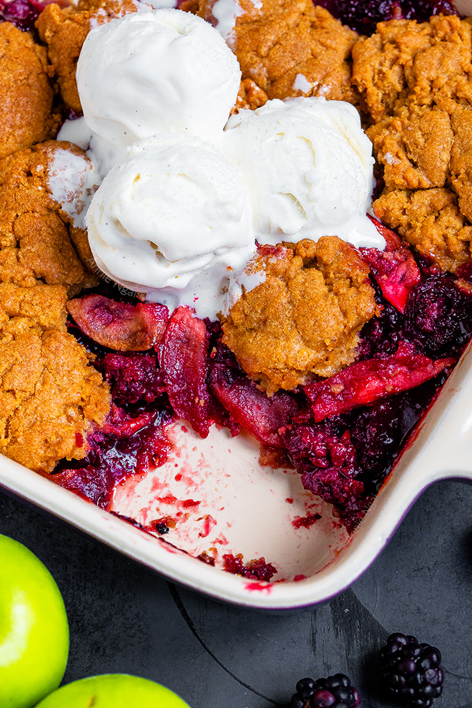 This Apple Blackberry Biscoff Cobbler is the perfect way to welcome a new season! Tart apples and juicy blackberries are married together and topped with soft fluffy Biscoff cobbler biscuits.