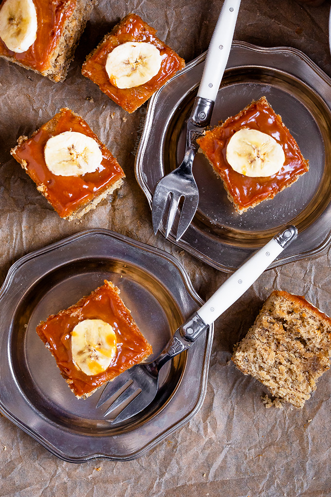 This Salted Caramel Banana Cake is easy to throw together and sinfully delicious. Sticky salted caramel atop a banana filled, light cake. Sliced into squares and served with coffee is the perfect way to enjoy it!