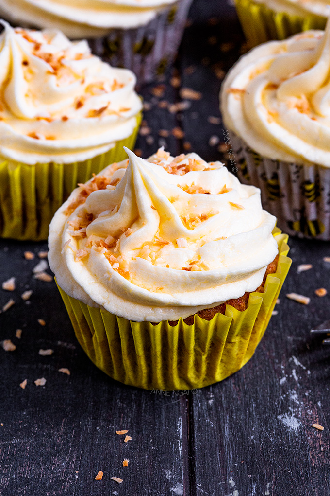 Spiced, carrot filled cupcakes topped with light, fluffy coconut frosting and toasted coconut, these Carrot Cake Coconut Cupcakes are the perfect Spring bake.